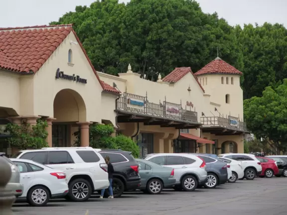 Italian restaurant with delicious gelato, independent bookstore, and excellent French bakery, plus castle tower and view of the mountains.