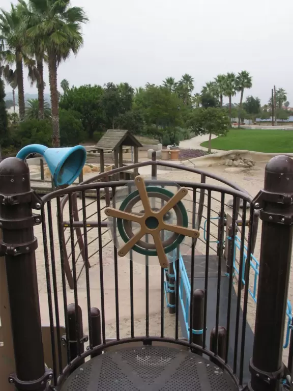 A remarkably pretty planned park with a stream that runs through it, lots of plants, an imaginative Spanish playground, and whale statues that spout water!