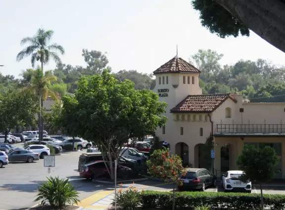 Italian restaurant with delicious gelato, independent bookstore, and excellent French bakery, plus castle tower and view of the mountains.