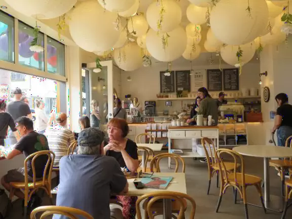 Hip area with wine bars, cafes, and bakeries, where you can sit on a patio surrounded by ivy-covered walls.