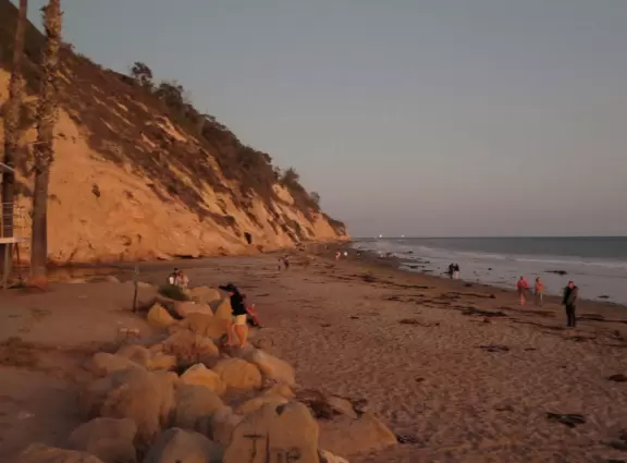 A popular beach with families and dog owners. Come for a long walk under beautiful cliffs.