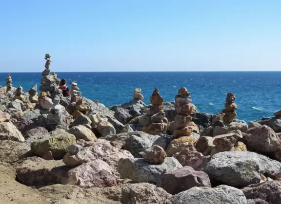 Huge sand dune along Highway 1, plus rock cairns along the ocean across the street.