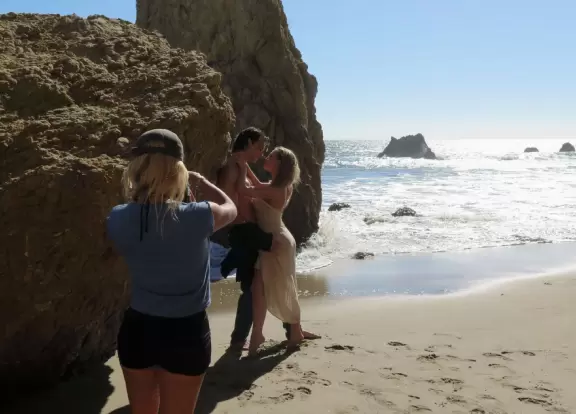 Incredible beach with blue-green water, rocks jutting out of the sea, arches, and caves.
