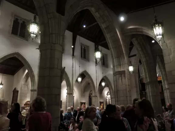 Delightful garden behind a gothic church, with lily pond, koi fish, tropical flowers, sculpted coral walls, fountain, and fresco.