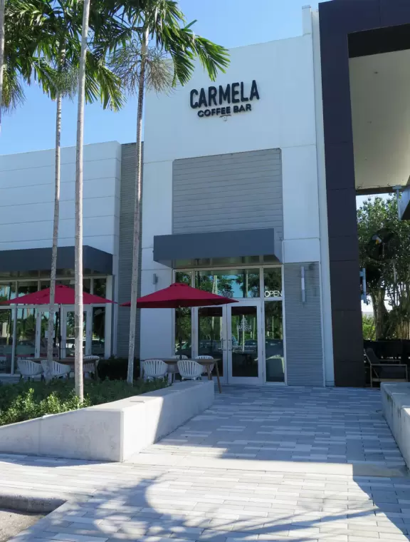 Outdoor mall with movie theater, cafes with atmosphere, candy shop, and more.