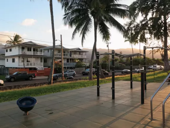 Sweet little beach with steep golden sand, shallow calm water, and a great playground and park full of people!