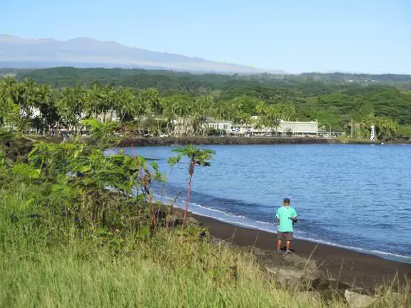 Green, green&nbsp;gardens with Japanese bridges and ponds, and views of silvery Hilo Bay and Mauna Kea.