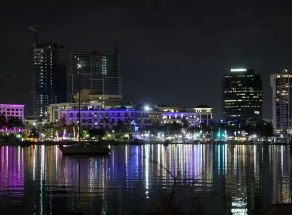 A cement bike and walking path along the intercoastal waterway in front of mansions and past glorious trees.