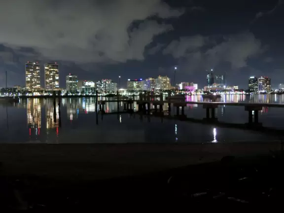 A cement bike and walking path along the intercoastal waterway in front of mansions and past glorious trees.