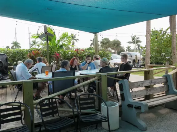 Beautiful area with white sand beach on turquoise river, playground, and small well-cared-for aquarium.