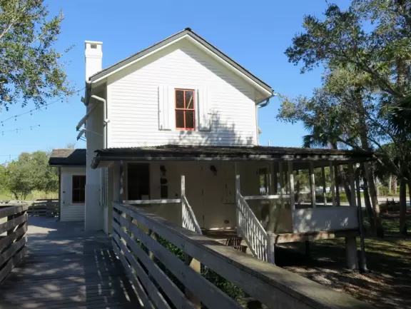 Popular 1.7 mile loop walking path with some shade and wooden boardwalk beside the river.