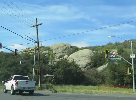 Pool with baby sea lions, through barbed wire.