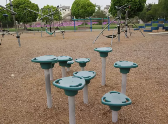 On weekends and after school, residents walk and play at the school playground.
