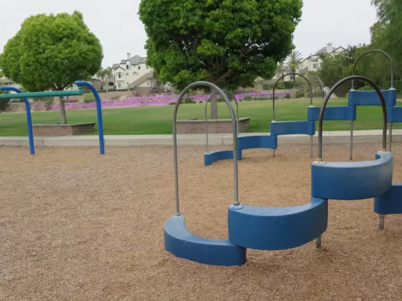 On weekends and after school, residents walk and play at the school playground.