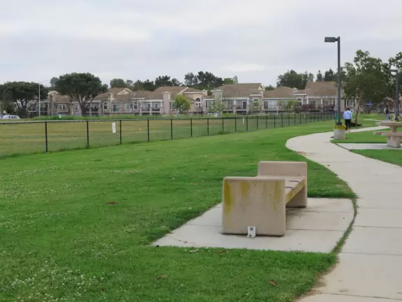 Loop walking path popular with residents, plus a playground.