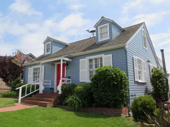 Adorable houses with gardens full of flowers, and streets leading down to lookout points over the ocean.