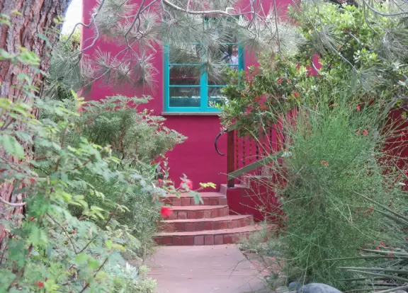 Adorable houses with gardens full of flowers, and streets leading down to lookout points over the ocean.