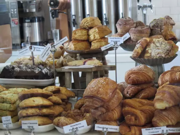 A main street of late 19th century storefronts, popular cafes, and a hip college scene. Recently, suffering an epidemic of homelessness relating to mental health problems.