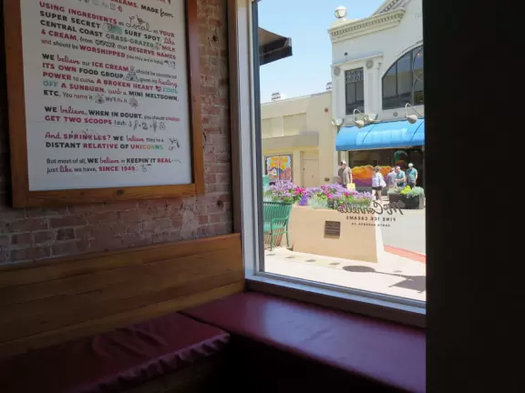 A main street of late 19th century storefronts, popular cafes, and a hip college scene. Recently, suffering an epidemic of homelessness relating to mental health problems.