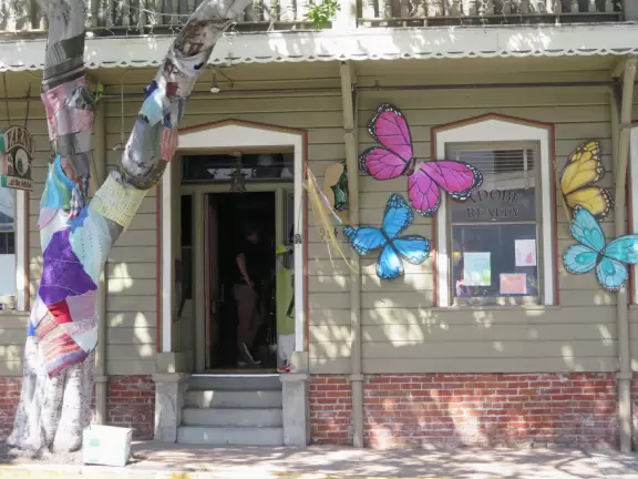 A main street of late 19th century storefronts, popular cafes, and a hip college scene. Recently, suffering an epidemic of homelessness relating to mental health problems.