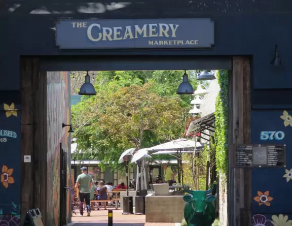 A main street of late 19th century storefronts, popular cafes, and a hip college scene. Recently, suffering an epidemic of homelessness relating to mental health problems.