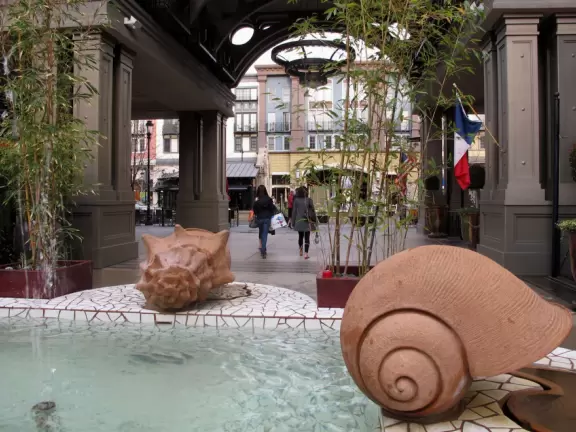 A sophisticated European-style development with shops, cafes, fountains, gorgeous architecture, and the most amazing flower baskets!