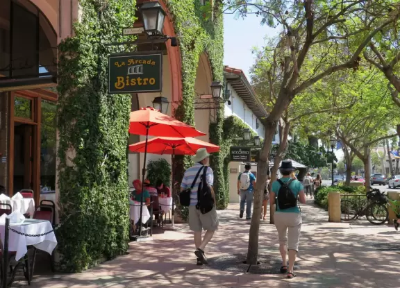 Street with beautiful historic arcades, cafes, and Spanish architecture.