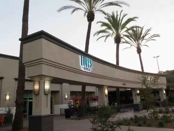 Nice place to dine, with a fountain area kids can run around and large sloping park above the center.