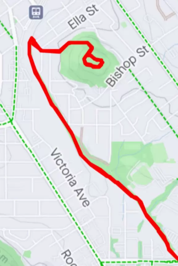 Bike path with views of hills all around, and pretty neighborhood nearby.