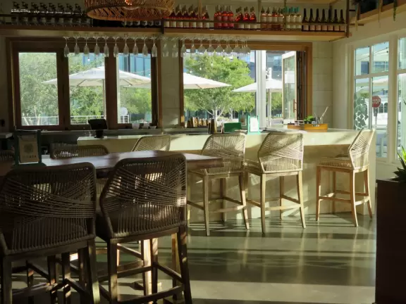 Upscale, colorful plaza in farmhouse style, with modern cafes. Kids climb on a huge log. The fire pit is fantastic at night, surrounded by eucalyptus trees.