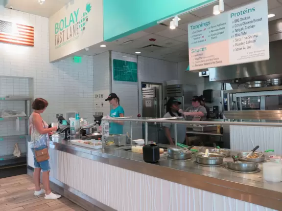 High-end outdoor shopping area with nice cafes and shops.