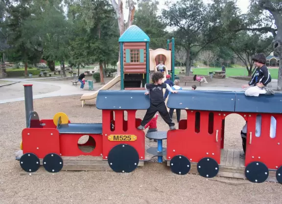 A fantastic park a&nbsp;jet plane, fire engine, and train to climb! Carousel, railroad rides, summertime paddle boat rides, walkway along a gorgeous creek, amazing tall pines, two play structures, and geese!