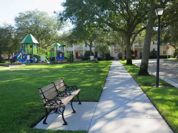 Lovely sidewalks lined with trees, where you pass fountains, parks, and colorful townhouses.