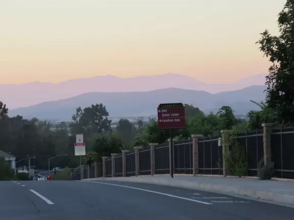 Outdoor shopping center with Daiso Japanese variety store.