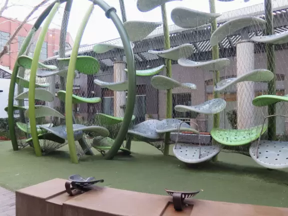 Modern outdoor mall with many places to eat, and nice decor.