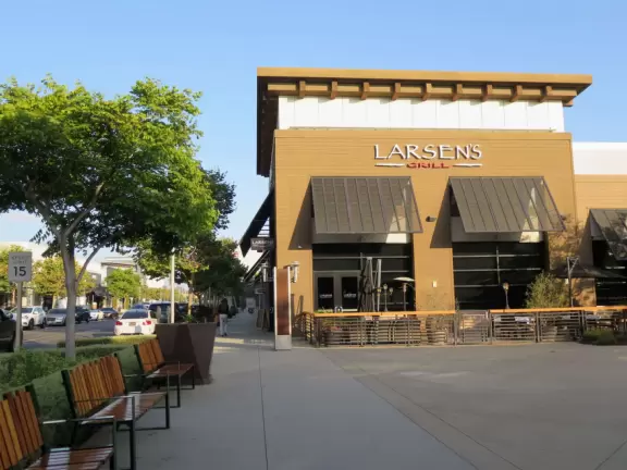 Modern mall with public spaces, fountains, splash pad, cafes, movie theater, and plenty of good shops.