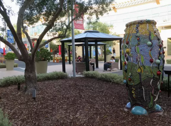 Modern mall with public spaces, fountains, splash pad, cafes, movie theater, and plenty of good shops.