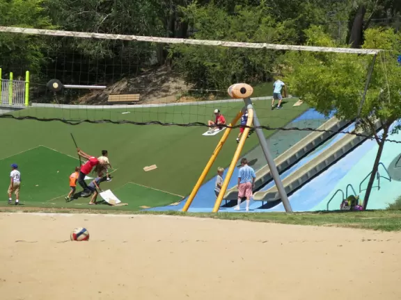 Best playground you'll ever visit! Huge slides, hillside slides, steep grass slope for cardboard sledding, cable zipline, and pretty trees to picnic under.