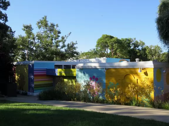 A main street of late 19th century storefronts, popular cafes, and a hip college scene. Recently, suffering an epidemic of homelessness relating to mental health problems.