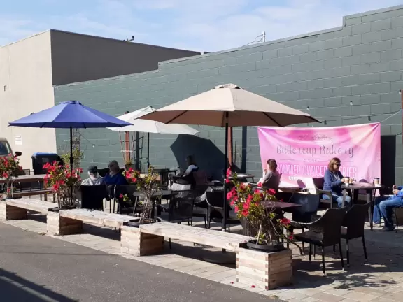 A lovely, hilly street with ocean views, lined with cute cafes.