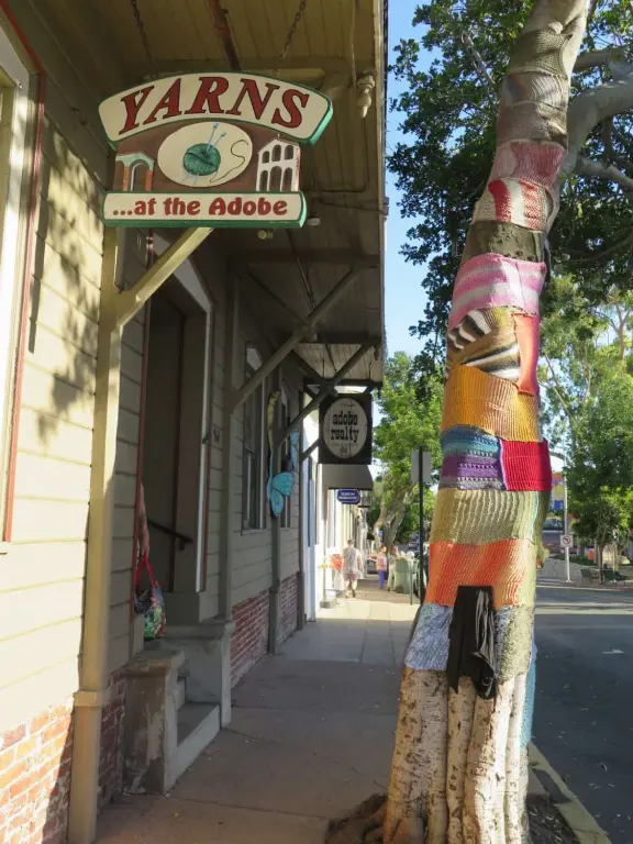 A main street of late 19th century storefronts, popular cafes, and a hip college scene. Recently, suffering an epidemic of homelessness relating to mental health problems.