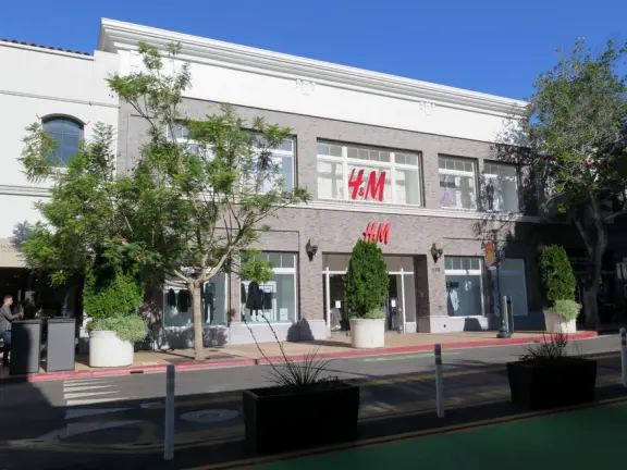 A main street of late 19th century storefronts, popular cafes, and a hip college scene. Recently, suffering an epidemic of homelessness relating to mental health problems.