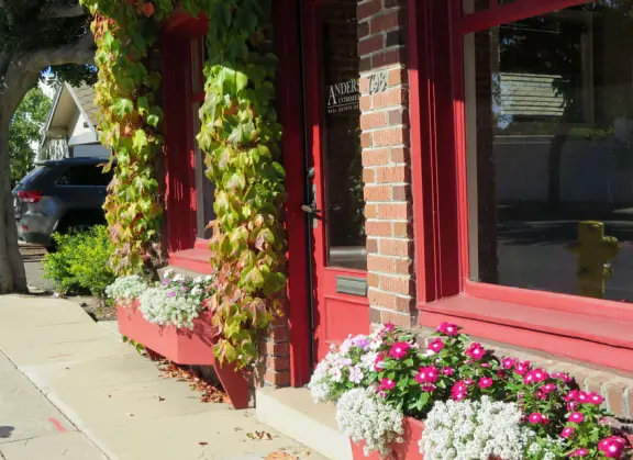 A main street of late 19th century storefronts, popular cafes, and a hip college scene. Recently, suffering an epidemic of homelessness relating to mental health problems.