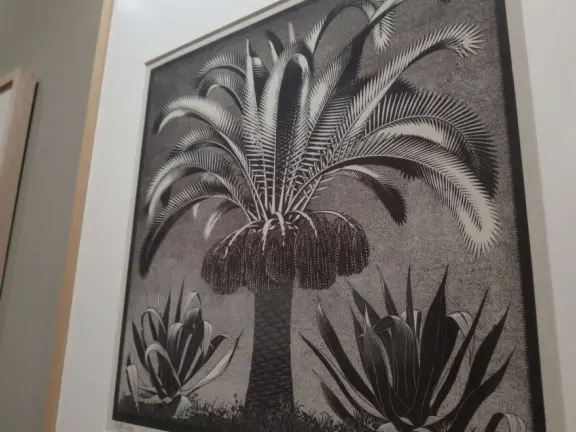 Beautiful palace in square full of trees, with strange and wonderful paintings and illustrations by M. C. Escher.