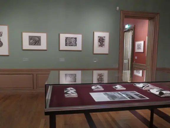 Beautiful palace in square full of trees, with strange and wonderful paintings and illustrations by M. C. Escher.