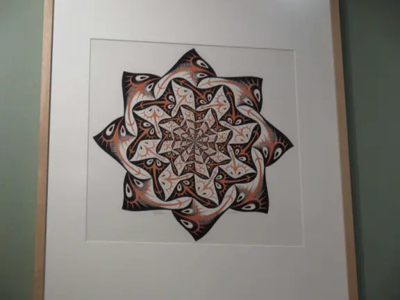 Beautiful palace in square full of trees, with strange and wonderful paintings and illustrations by M. C. Escher.