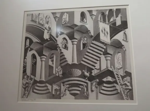 Beautiful palace in square full of trees, with strange and wonderful paintings and illustrations by M. C. Escher.