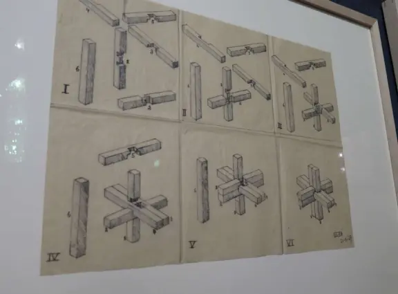 Beautiful palace in square full of trees, with strange and wonderful paintings and illustrations by M. C. Escher.