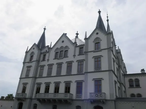 Beautiful waterfront walking path with flower beds, giant fork sculpture on the water, food museum with interesting garden, and square with historic buildings and cafes.
