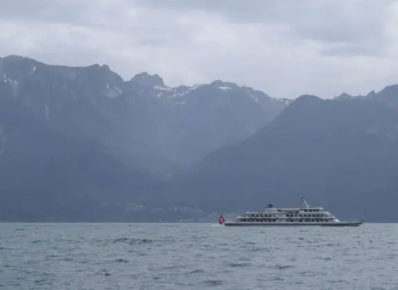 Beautiful waterfront walking path with flower beds, giant fork sculpture on the water, food museum with interesting garden, and square with historic buildings and cafes.